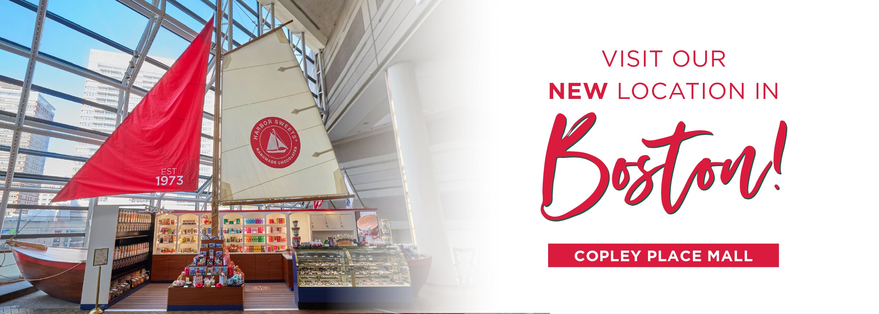 Advertisement for a new location in Boston at Copley Place Mall, featuring a sailboat model and red flag.