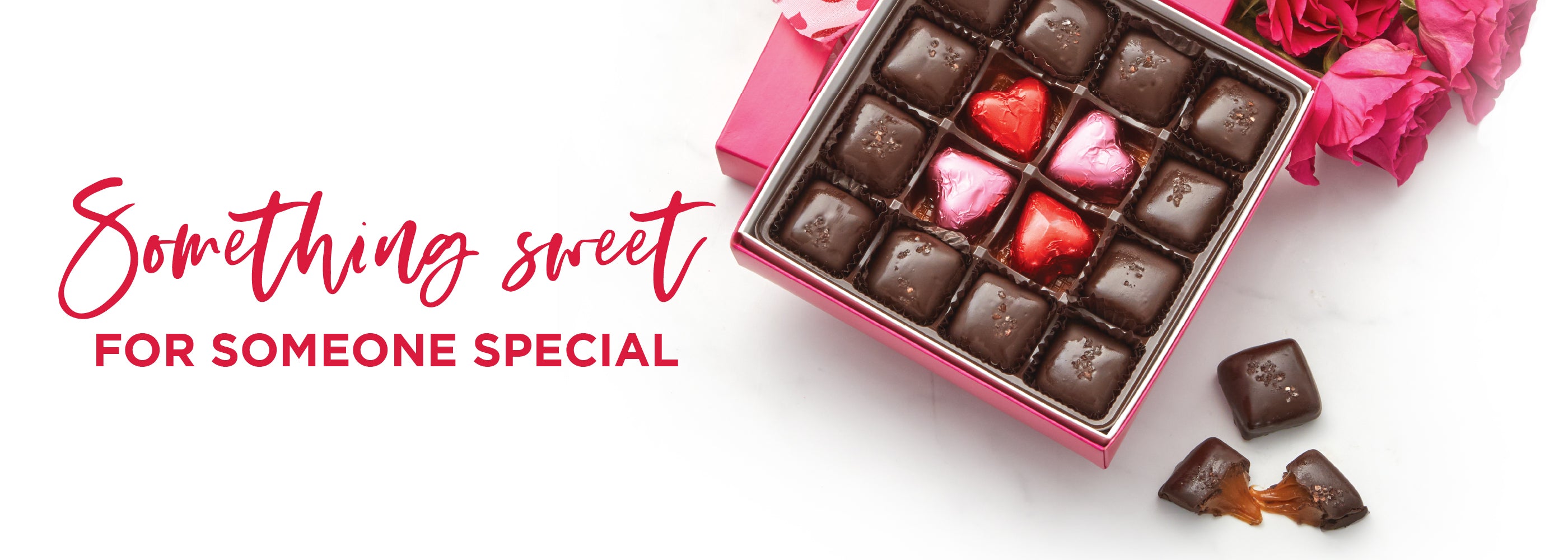 Valetnines Banner showing box of caramels with red and pink foiled hearts