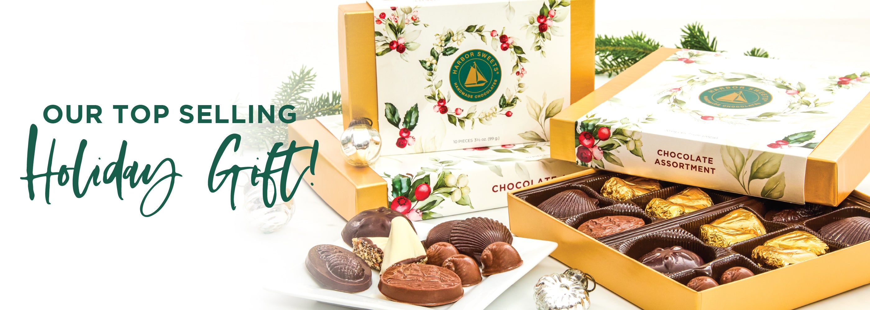 Assorted chocolate truffles in a decorative box with holiday-themed packaging.