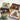 Two open box of assorted chocolates one milk one dark. Lid features a Christmas tree and wrapped gifts. Dark chocoalte has a green background, milk chocolate has a white background.