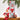 Silver box wtih elf on the cover. Elf holding a chocolate covered oreo with red and white lines sitting next to the box.