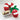 A red and white candy cane-shaped gift box tied with a green ribbon, shown with three Sweet Sloops in a small white dish on a light marble surface.