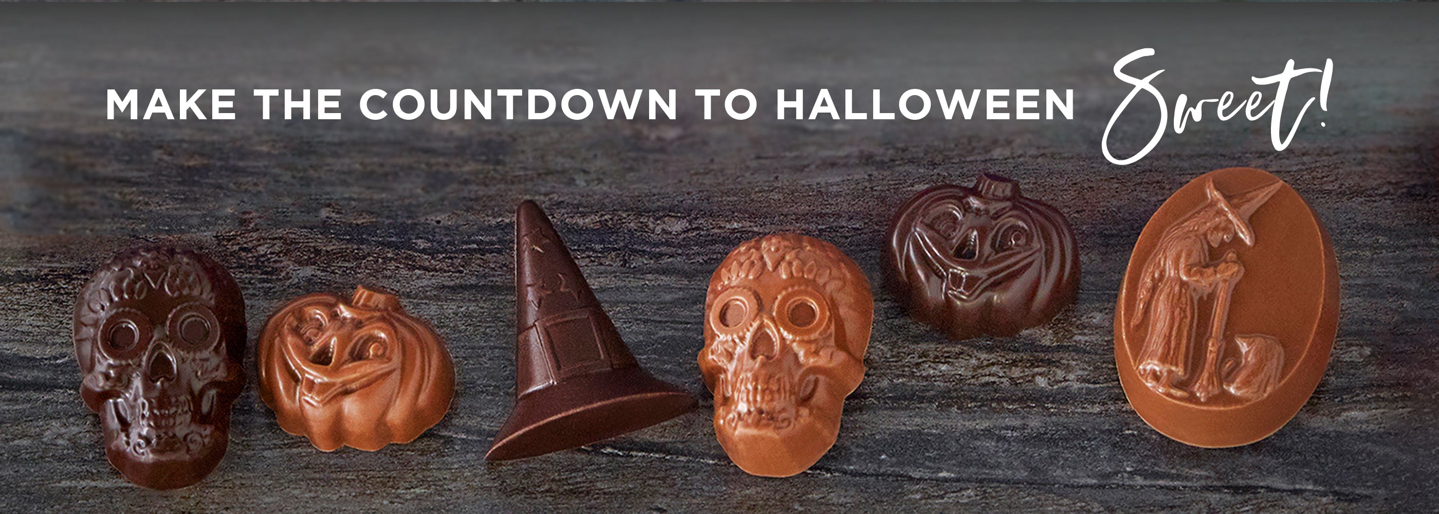 Halloween chocoaltes including a skull, pumpkin witch hat and witch. Text above read, make the countdown to Halloween Sweet!